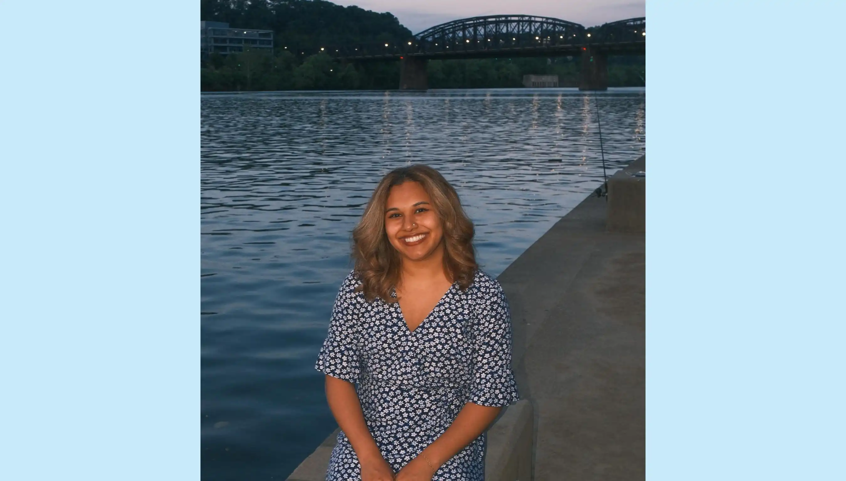 A portrait photo of Shreya Kochar in front of a river.