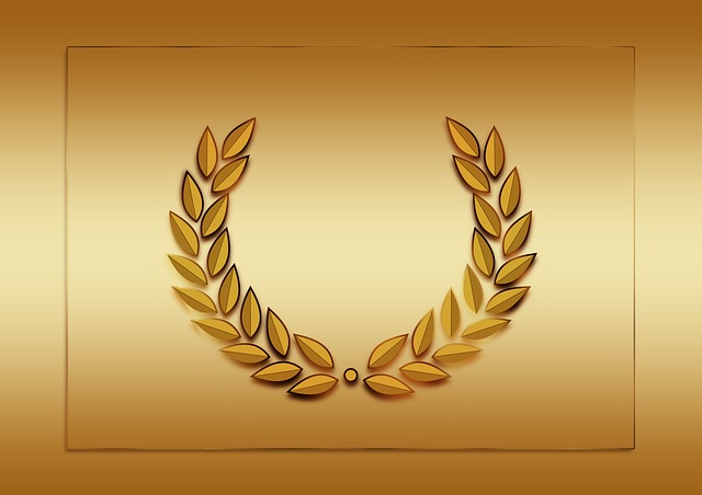 A picture of a laurel wreath with gold backround.